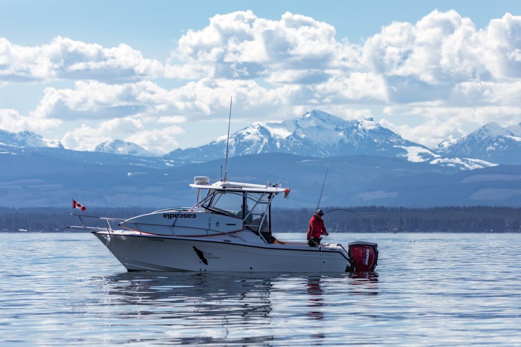 Campbell River fishing boat with mountain scene background