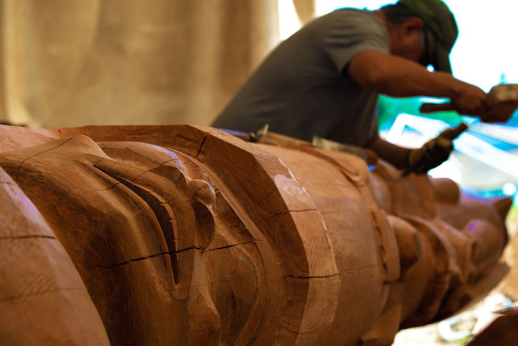 Victoria International Marina welcome pole being carved